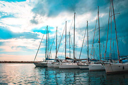 sail boat on doking port during daytime thumbnail
