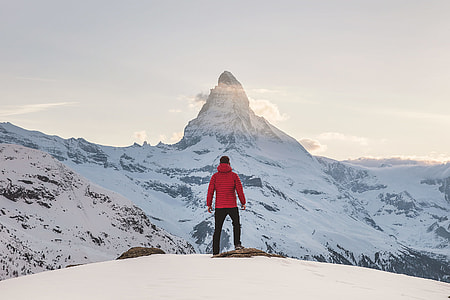 person standing on mountain slope covered with snow thumbnail