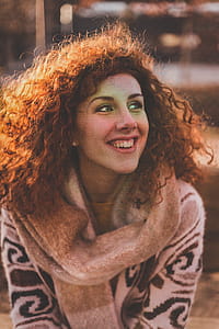 Woman With Blonde Hair Wearing Brown Sweater thumbnail
