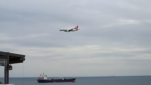 flying white and red airplane thumbnail