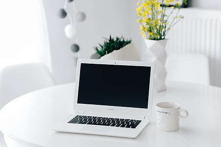 Workplace with laptop on table at home thumbnail