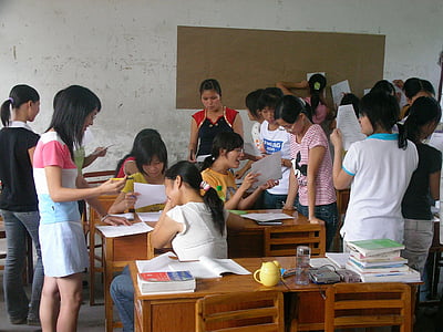 group of people inside room holding papers thumbnail