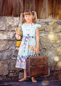 girl carrying suitcase and bear plush toy thumbnail