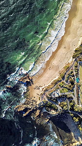 aerial view photography of shore and ocean thumbnail