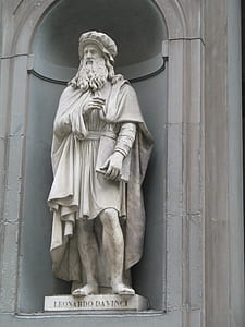 male holding book statue thumbnail