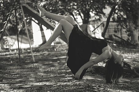 grayscale photo of woman wearing black dress on slide thumbnail