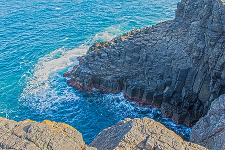 Grey Rock Formation Near Water thumbnail