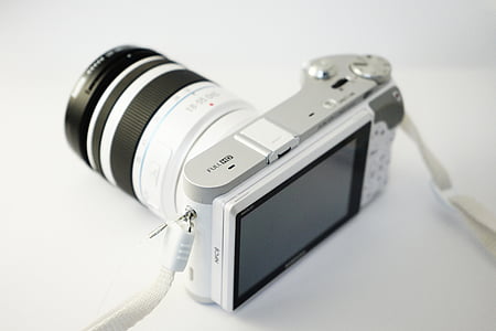 white and black point-and-shoot camera thumbnail