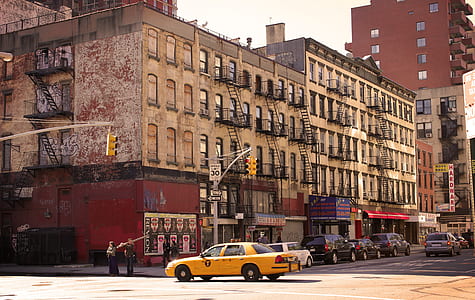 vehicles on street near brown concrete buildings during daytime thumbnail