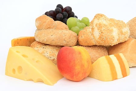 close-up photography of baked breads, cheese, grapes, and peach thumbnail