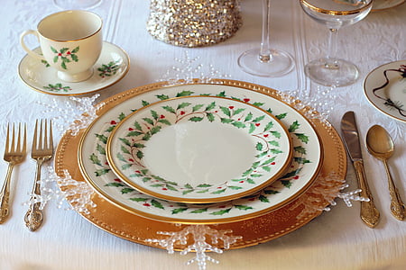 white ceramic dining plates and spoon and forks thumbnail