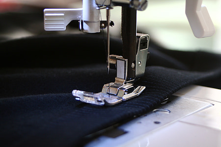 close-up photography of white electric sewing machine thumbnail