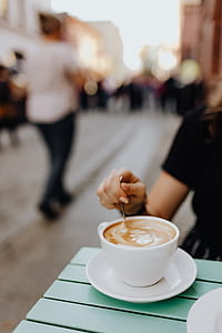 Drinking coffee and eating cake in a cafeteria thumbnail