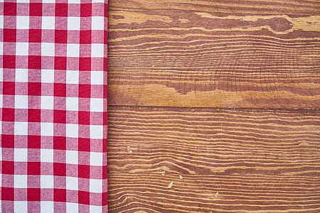 white and red gingham table cloth on brown table thumbnail