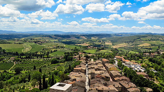 Aerial photography of houses and mountain during day time thumbnail