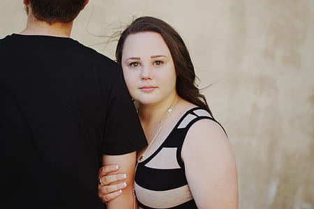 woman holding man's arm thumbnail