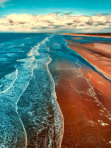 blue sea with brown sand thumbnail