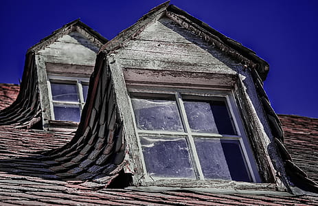 low angle photography of attic window thumbnail