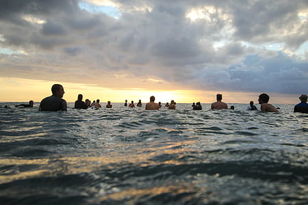 people swimming on beach thumbnail