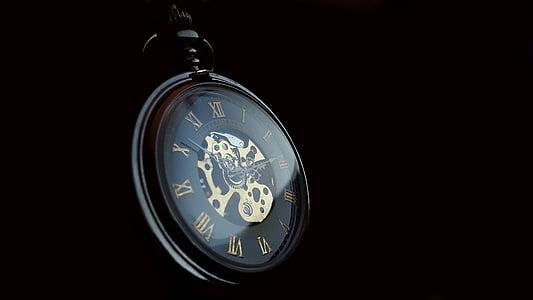 black pocket watch with black background thumbnail