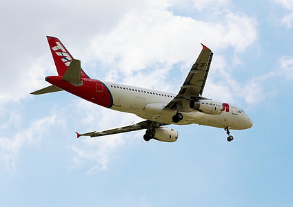photograph of white and red airliner plane thumbnail