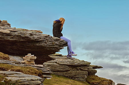 woman sitting on cliff thumbnail
