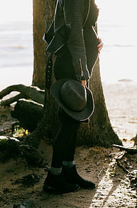 Photo of Pregnant Woman Standing Behind the Tree thumbnail