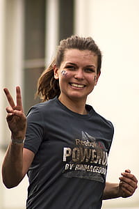 Woman Running Wearing Gray Shirt thumbnail