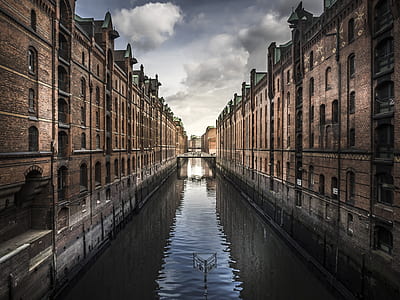 river in between brown buildings thumbnail