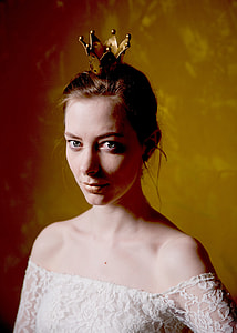 woman with white off-shoulder top and gold-colored crown thumbnail