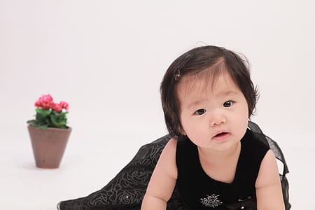 girl wearing black sleeveless dress crawling thumbnail