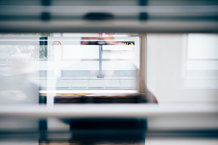 person in black shirt standing by the glass window thumbnail