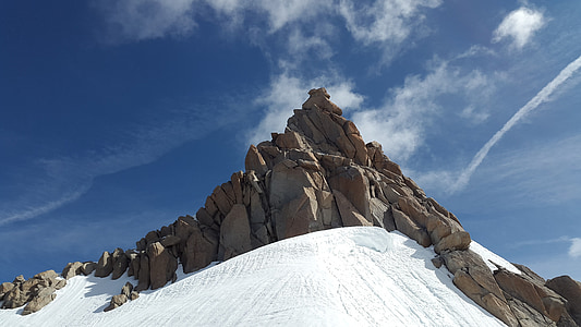 snow-covered mountain peak under clouds thumbnail