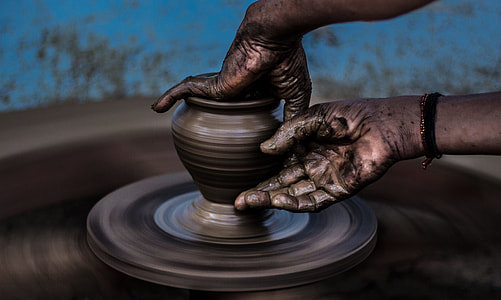 person molding brown vase thumbnail