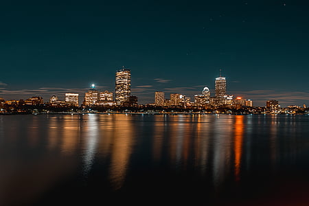 city lights reflecting on body of wate thumbnail