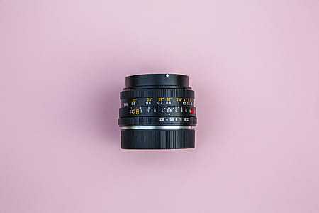 black camera lens on pink surface thumbnail