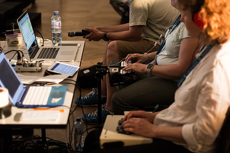 person sitting down facing laptop thumbnail