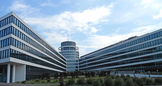 architectural photography of white multi-storey concrete building thumbnail