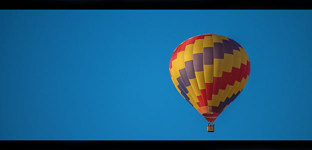 yellow, purple, and red floating hot air balloon thumbnail