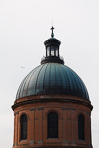 black and brown concrete church with cross on top during daytime thumbnail