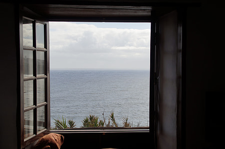 photo of open window near on ocean thumbnail