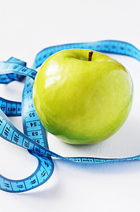 granny apple beside blue measuring tape thumbnail