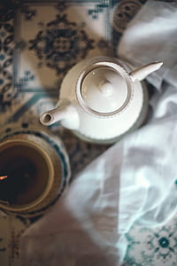 white ceramic kettle near teacuo thumbnail