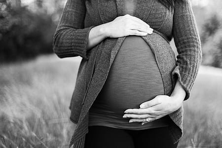 grayscale photo of pregnant woman thumbnail