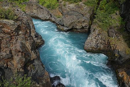 river surrounded by rocky mountain thumbnail