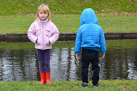 two children wearing jackets during daytime thumbnail