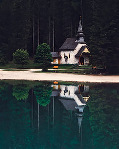 gray house near body of water thumbnail