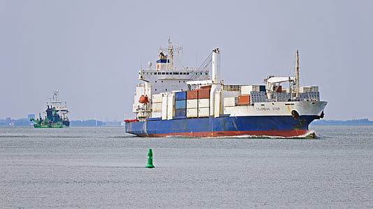 white and blue cargo ship during daytime thumbnail