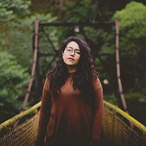 woman standing on bridge thumbnail