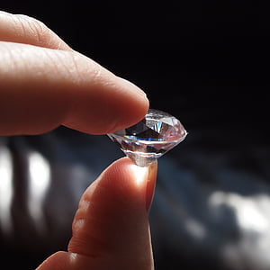 person holding diamond stone thumbnail